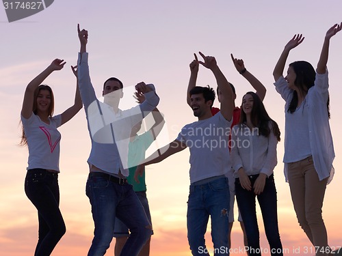 Image of party people  on sunset