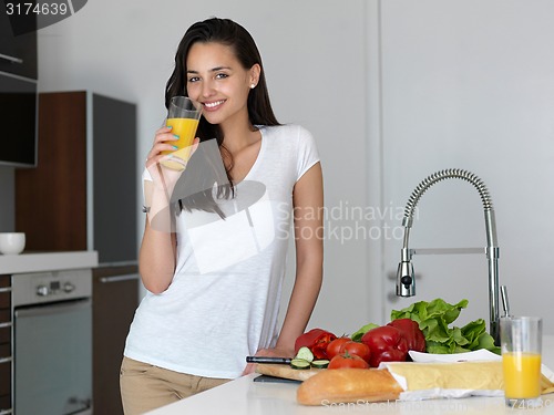 Image of happy young couple in kicthen