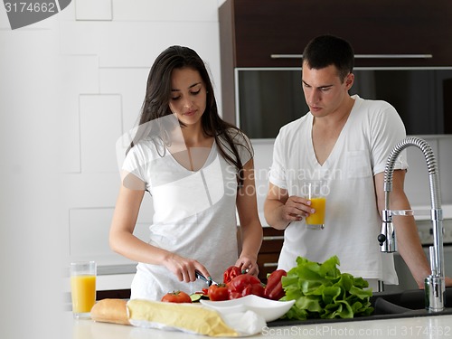 Image of happy young couple in kicthen