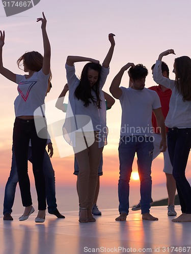 Image of party people  on sunset