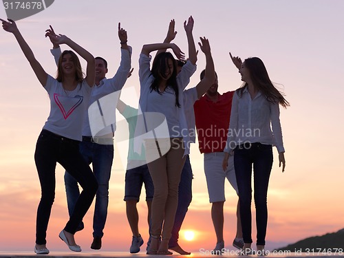 Image of party people  on sunset