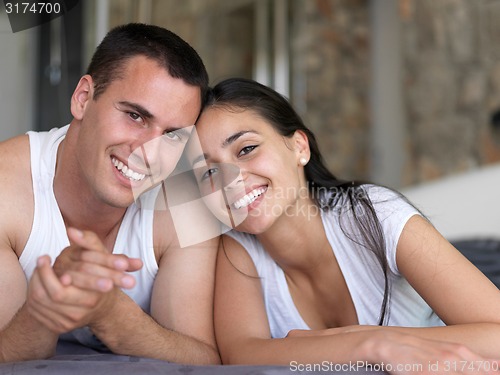 Image of couple relax and have fun in bed