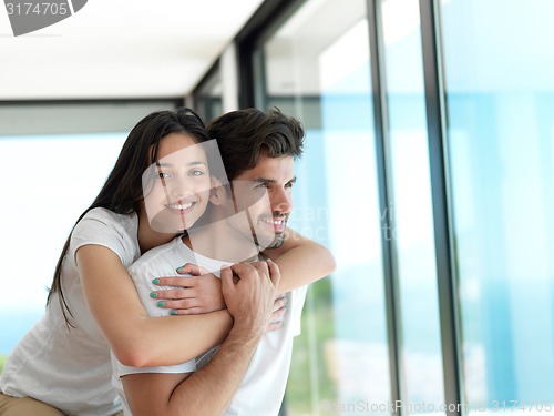 Image of relaxed young couple at home