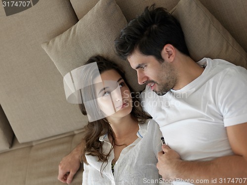 Image of young couple making selfie together at home