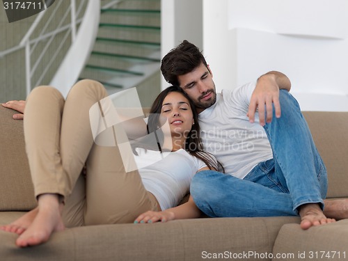 Image of young couple making selfie together at home