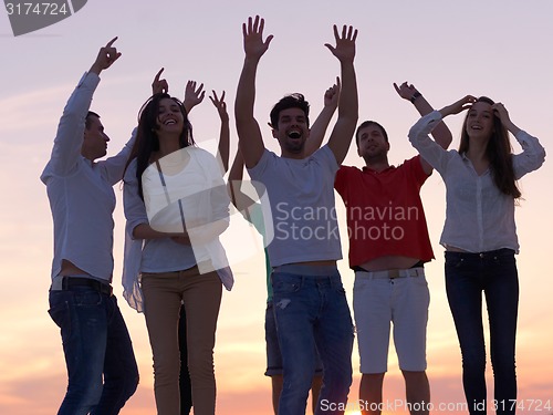 Image of party people  on sunset