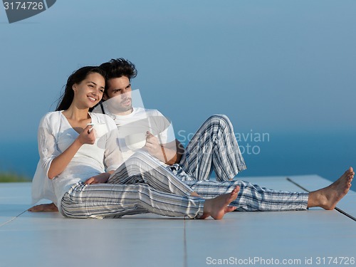 Image of relaxed young couple at home