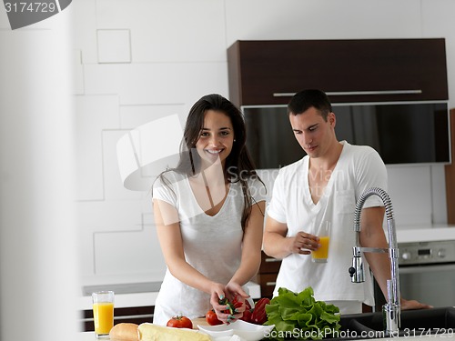 Image of happy young couple in kicthen