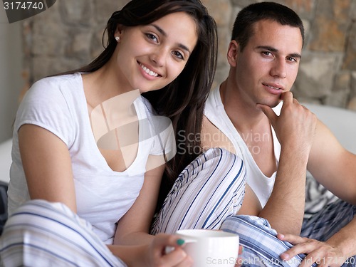 Image of couple relax and have fun in bed