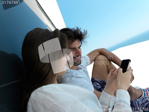 Image of young couple making selfie together at home