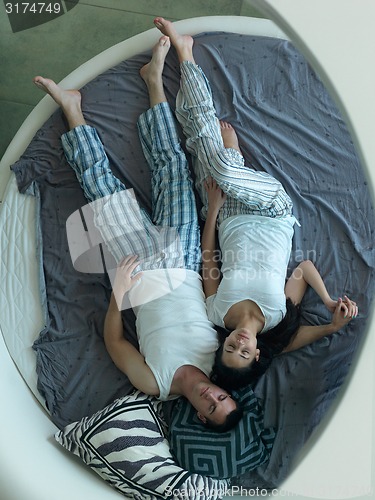 Image of couple relax and have fun in bed