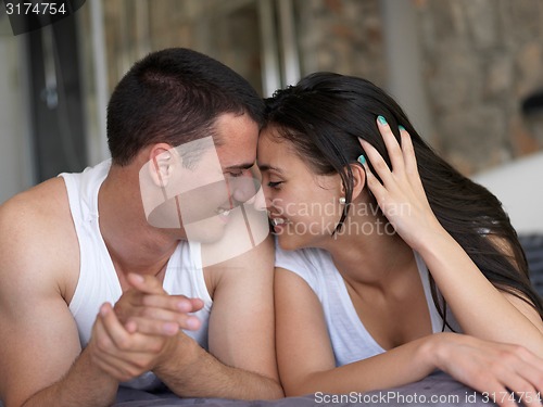 Image of couple relax and have fun in bed