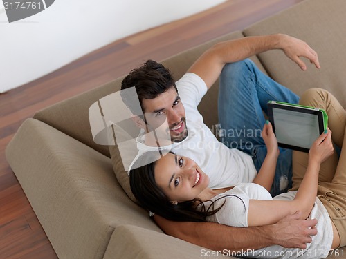 Image of young couple making selfie together at home