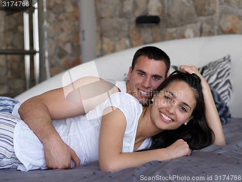 Image of couple relax and have fun in bed