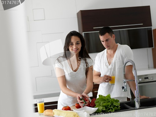 Image of happy young couple in kicthen