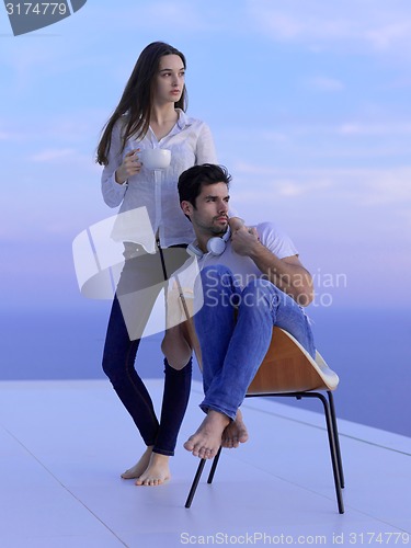 Image of relaxed young couple at home