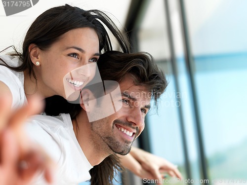 Image of relaxed young couple at home