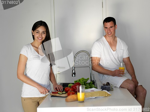 Image of happy young couple in kicthen