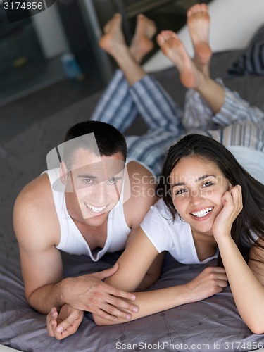 Image of couple relax and have fun in bed