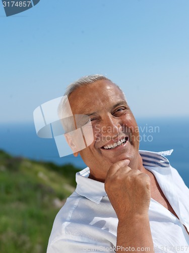 Image of senior man sitting outside