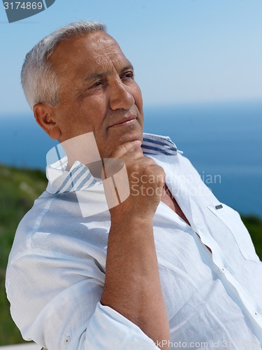 Image of senior man sitting outside