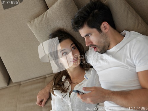 Image of young couple making selfie together at home