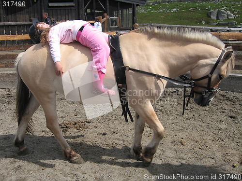 Image of Tired horsebackrider