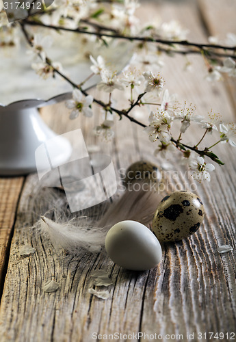 Image of Easter still life with a flowering branch.