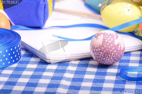 Image of Easter background with eggs, ribbons and spring decoration