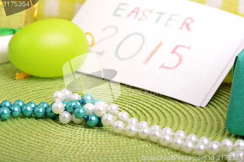 Image of Easter setting with gift box and spring decoration