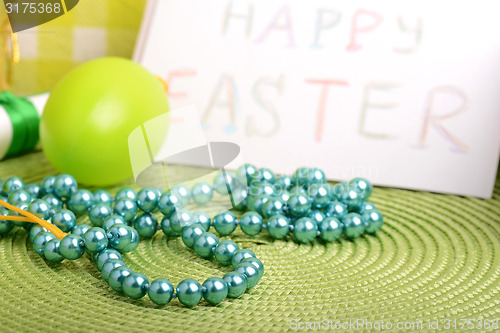 Image of Easter setting with gift box and spring decoration