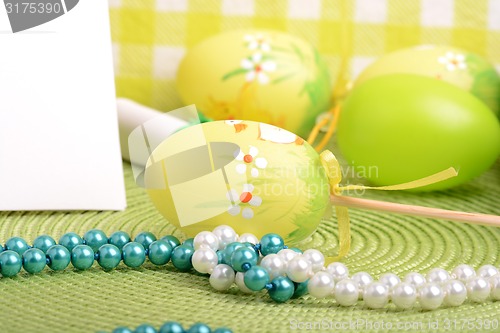 Image of Easter setting with gift box and spring decoration