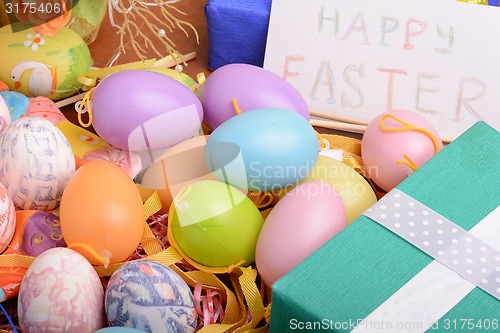 Image of Easter setting with gift box and spring decoration