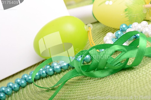 Image of Easter setting with gift box and spring decoration