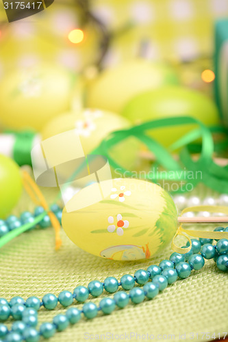 Image of Easter background with eggs, ribbons and spring decoration