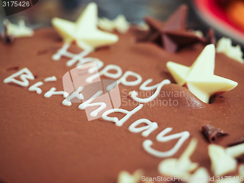 Image of Happy birthday chocolate cake with white icing text