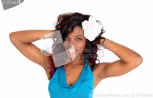Image of Woman with hands behind head.