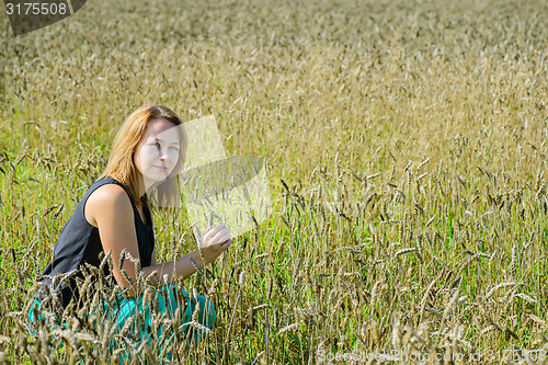 Image of Portrait of woman in field