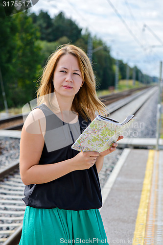 Image of Female waiting train on the platform 