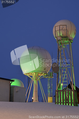 Image of Satellite antennas with green light