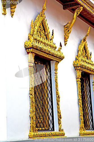 Image of window   in  gold    temple      thailand incision of  temple 