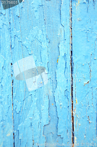 Image of dirty   paint in the   wood door and rusty nail