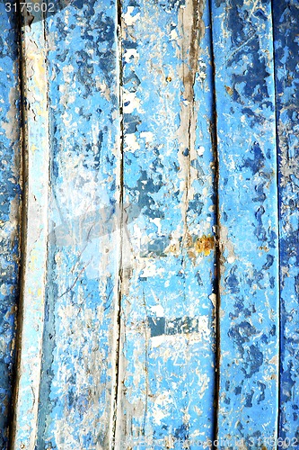Image of blue   and rusty nail