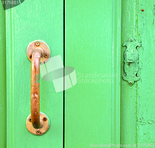 Image of spain   brass knocker  abstract door wood in the 