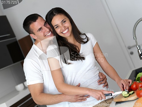 Image of happy young couple in kicthen