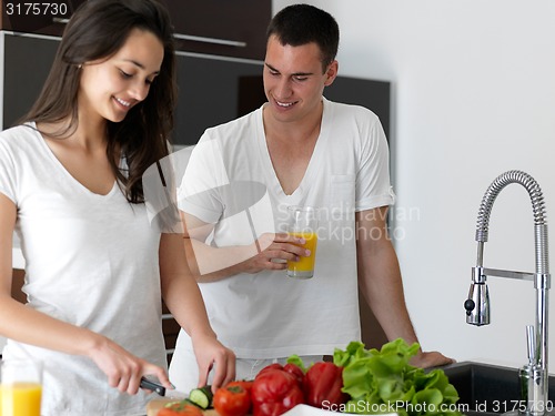 Image of happy young couple in kicthen