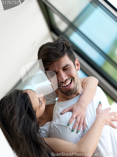 Image of relaxed young couple at home