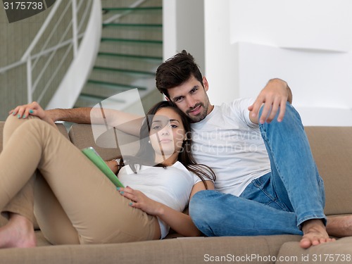 Image of young couple making selfie together at home