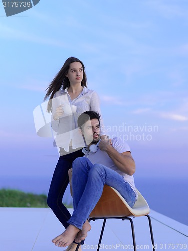 Image of relaxed young couple at home