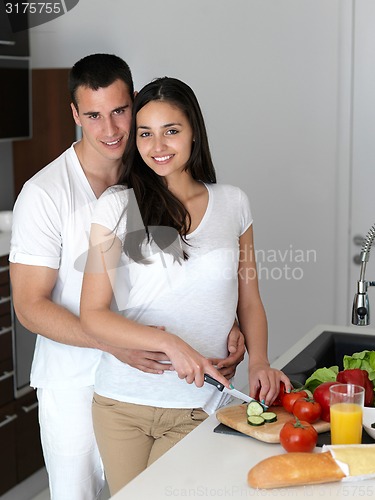 Image of happy young couple in kicthen